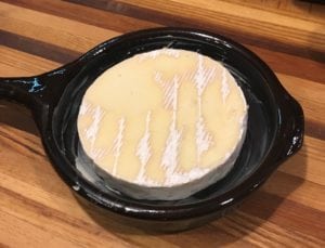 Brie cheese in sartan frying pan before heat